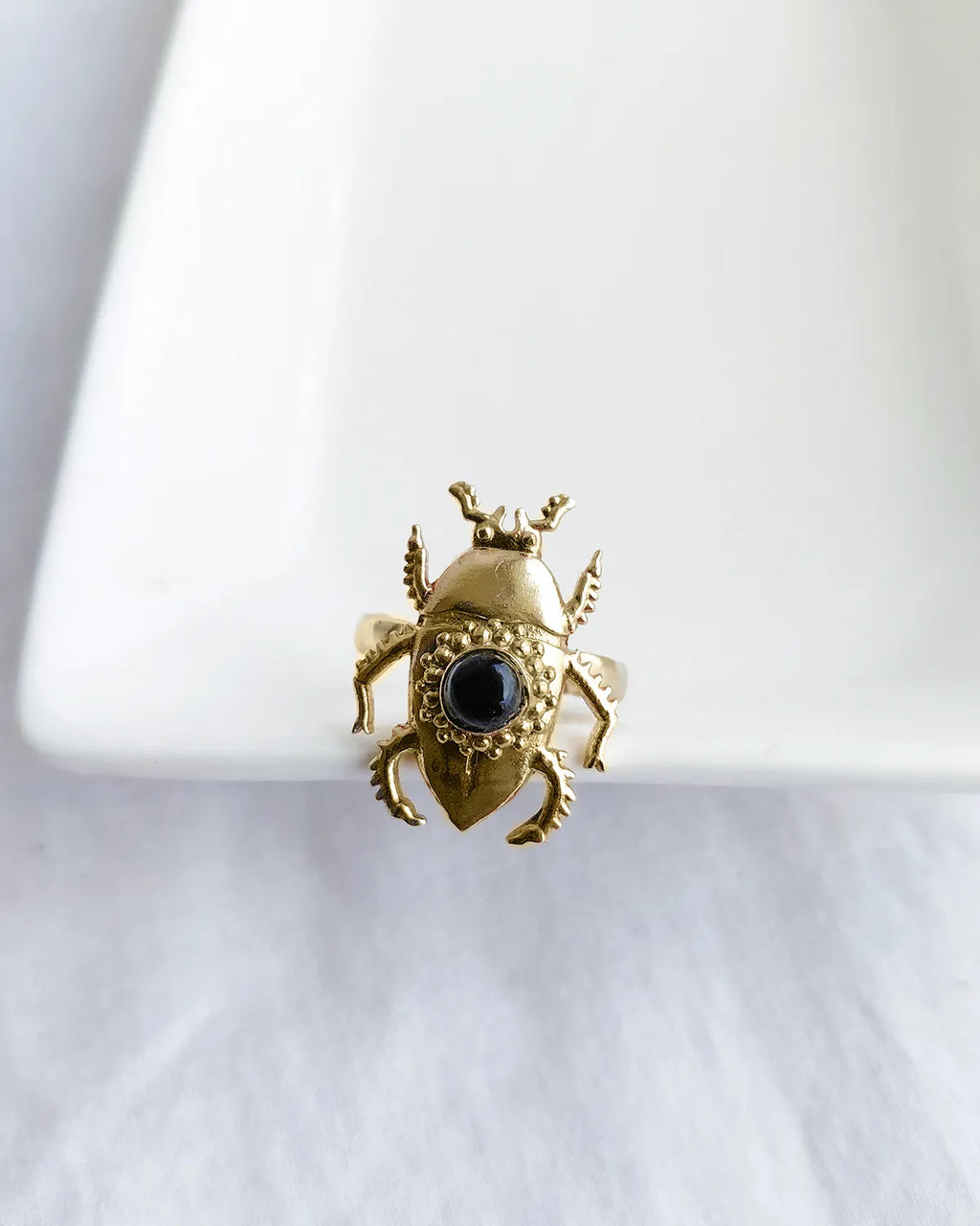 Scarab Muse gold plated ring with black stone front view