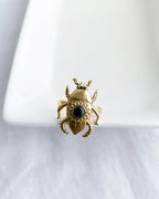 Scarab Muse gold plated ring with black stone front view
