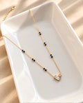 Gold-tone black bead mangalsutra with rectangular and round clear stone duo pendant