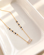 Emerald cut crystal-style pendant mangalsutra with black and gold beads