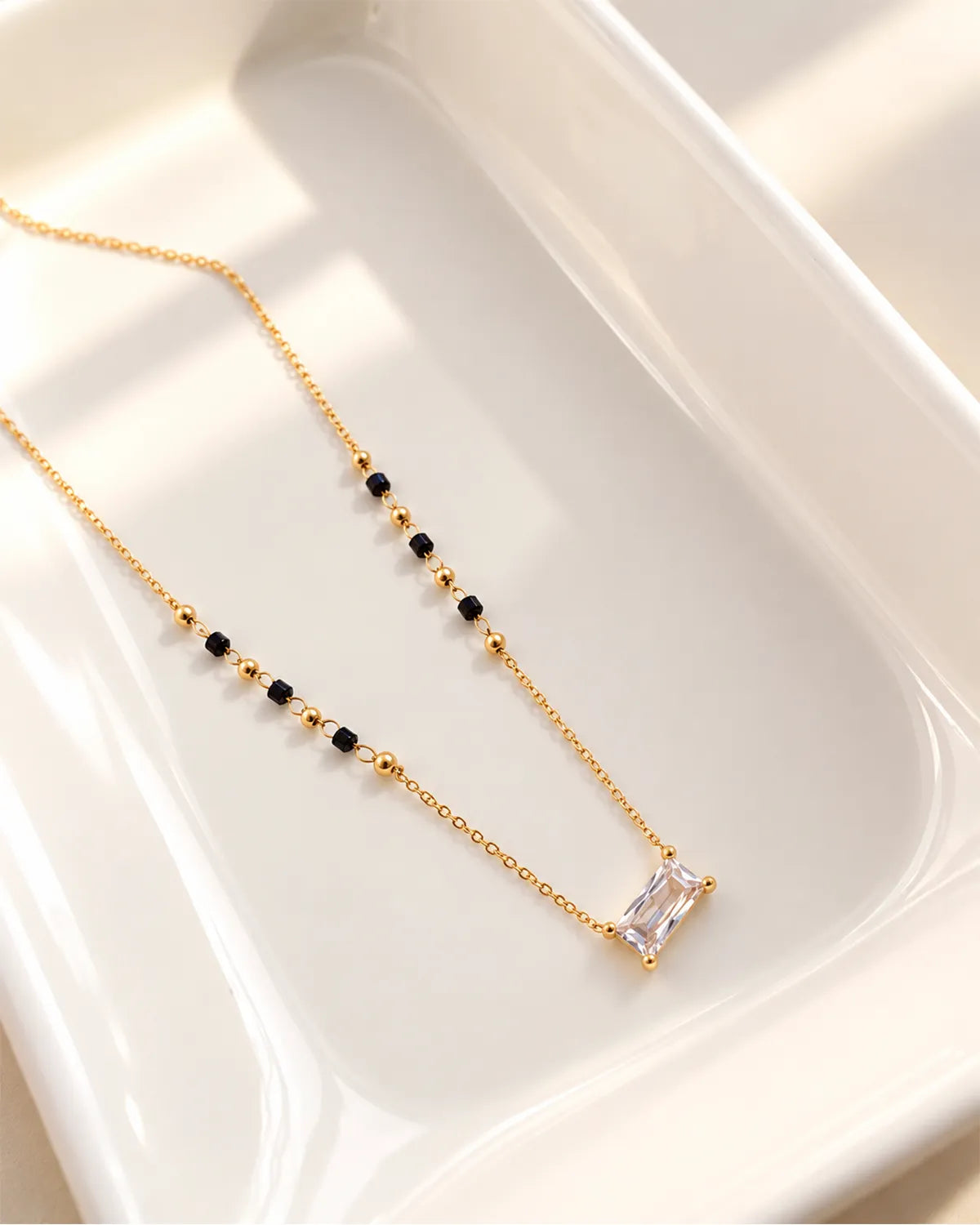 Emerald cut crystal-style pendant mangalsutra with black and gold beads