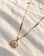 Sunburst floral motif triangular pendant black bead mangalsutra necklace