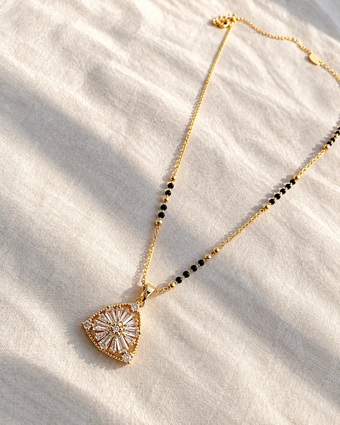 Sunburst floral motif triangular pendant black bead mangalsutra necklace