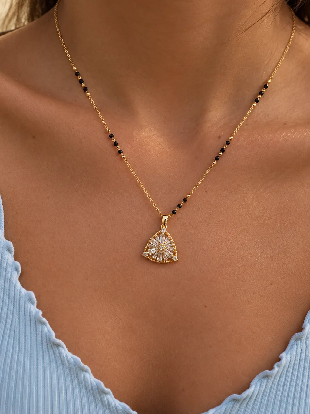 Sunburst floral motif triangular pendant black bead mangalsutra necklace