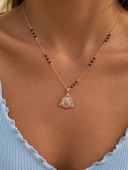 Sunburst floral motif triangular pendant black bead mangalsutra necklace