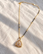 Sunburst floral motif triangular pendant black bead mangalsutra necklace
