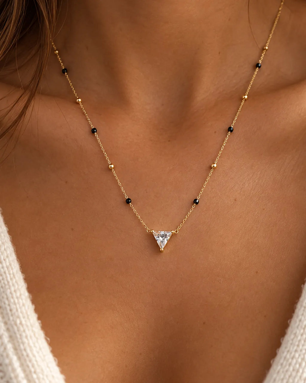 Triangle solitaire-style clear stone pendant mangalsutra with black and gold beads