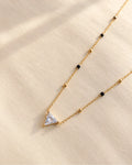 Triangle solitaire-style clear stone pendant mangalsutra with black and gold beads