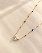 Triangle solitaire-style clear stone pendant mangalsutra with black and gold beads