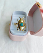 Turquoise blue scarab gold plated ring in pink jewellery box