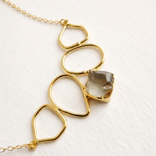 Gold statement necklace with natural gemstone