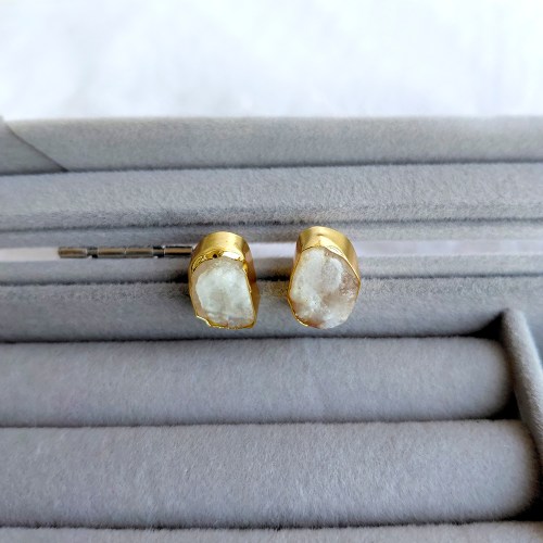 18K Gold Plated Moonstone Stud Earrings with natural raw white moonstone stones on a jewellery tray